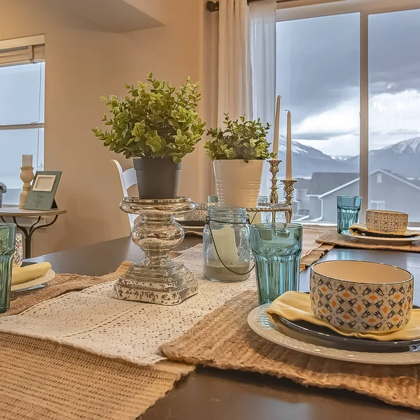 Square frame Lovely dining setting with hemp table runner and placemats on the wooden table