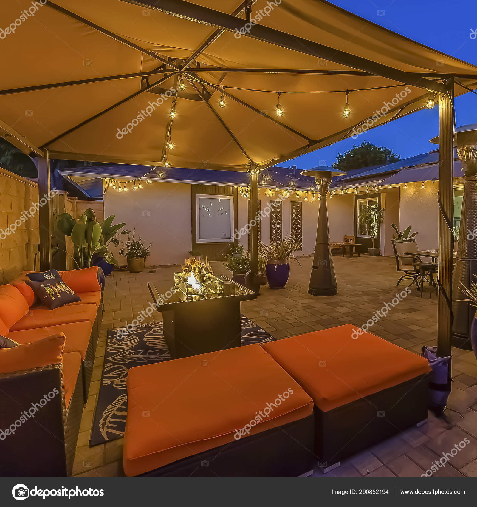 Frame Cozy outdoor seating area under a pavilion on the patio