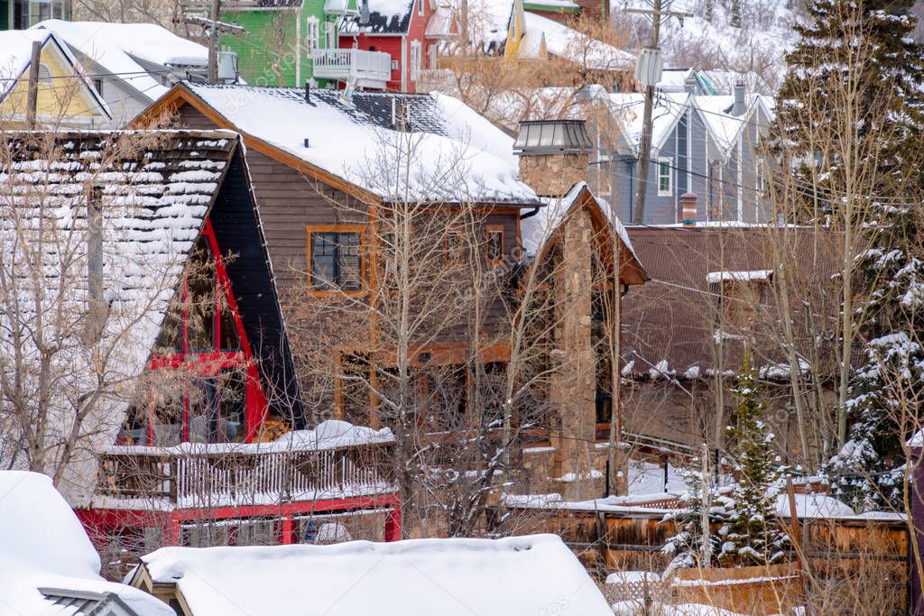 Park City Utah neighborhood in winter with houses on snowy mountain slope