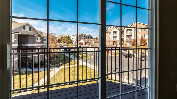 Panorama Urban street viewed through a cottage pane window