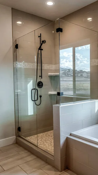 Vertical Rectangular walk in shower stall with half glass enclosure and black shower head — Stock Photo, Image