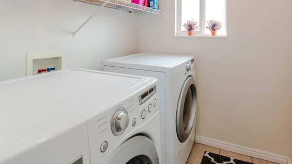 Panorama crop Laundry room in house with electrical appliances — Stock Photo, Image