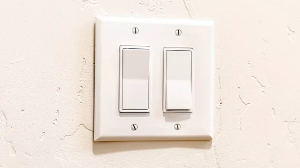 Panorama Indoor multiple rocker light switch with broad flat levers and cover plate