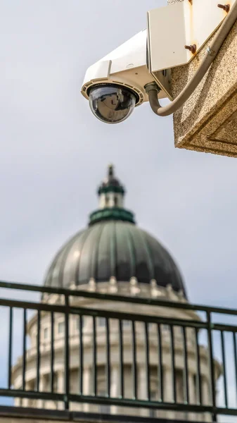 Vertical Outdoor dome security cctv camera with Utah State Capital Building background — Stock Photo, Image