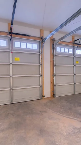 Vertical crop Inside an empty double vehicle garage interior