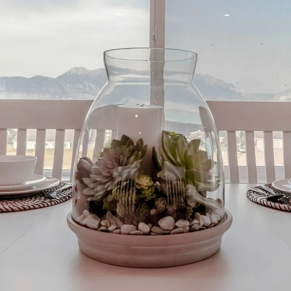 Square Home dining room with mountain and scenic outdoor view through the window