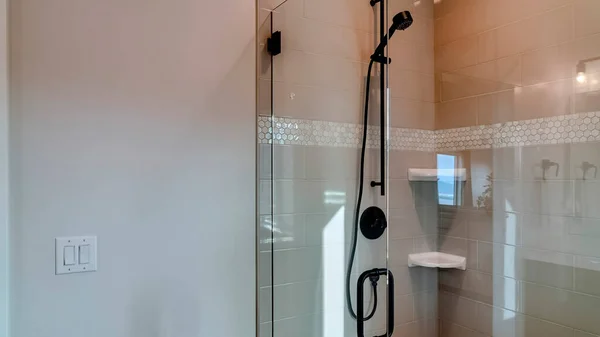 Panorama frame Shower stall with frameless glass enclosure and hinged door inside bathroom