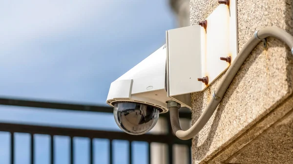 Panorama crop Outdoor cctv security dome camera installed on the exterior wall of a building — Stock Photo, Image