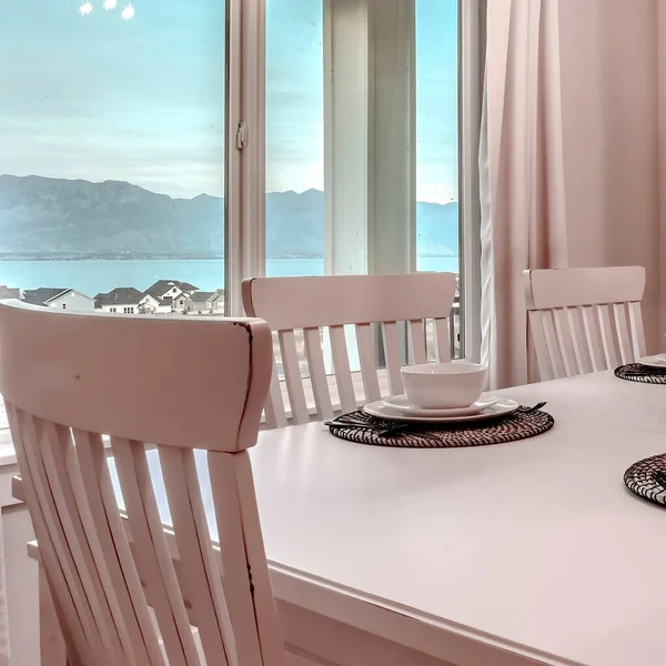 Square Dining room with mountain lake neighborhood and porch view through the windows