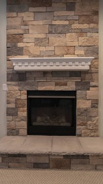 Vertical Fire insert in a feature stone brick wall clipart