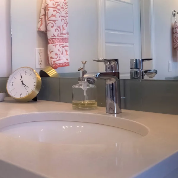 Square crop Close up of sink faucet cabinet and mirror inside the bathroom with white door — Stock Photo, Image