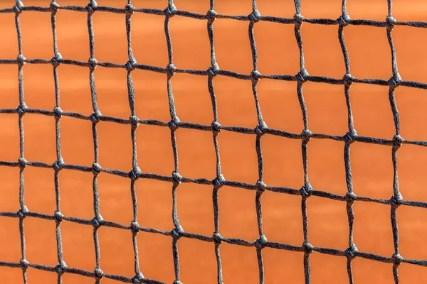 Texture of the net at a clay tennis court.