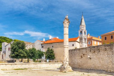 Pillar of Shame and Saint Elias church in historic center of Zadar town, Croatia, Europe. clipart