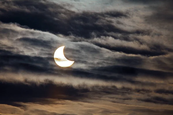 Partial Solar Eclipse on a dark background.