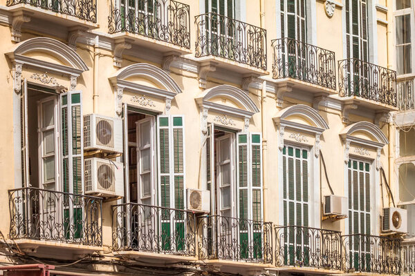 Equipment of outdoor air-conditioning units on the facade of a historical house.