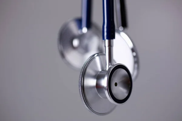 Heads of a stethoscope on a gray — Stock Photo, Image