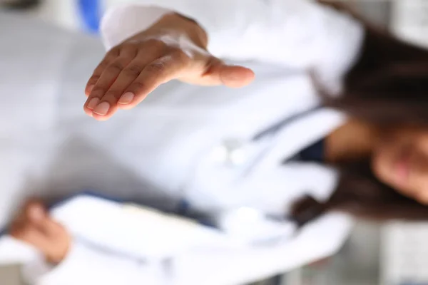 Doctor shake hand as hello with patient