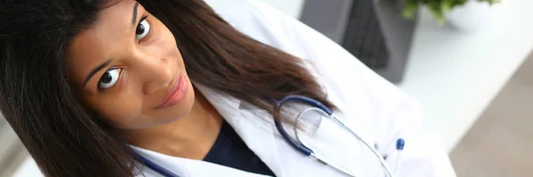 Beautiful smiling female doctor hold