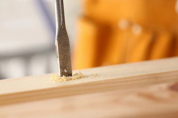 Flat drill bit make hole in wooden bar closeup — Stock Photo, Image