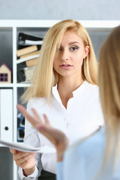 Young couple trying to get loan at bank clerk consultant