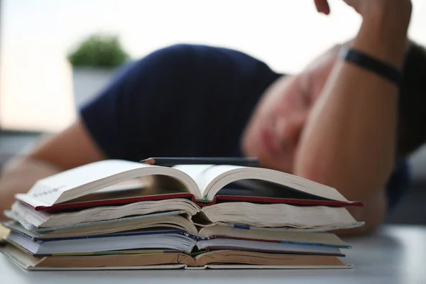 Tired male student at workplace in room — Stock Photo, Image