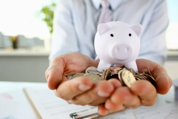 Hand businessman putting pin money — Stock Photo, Image