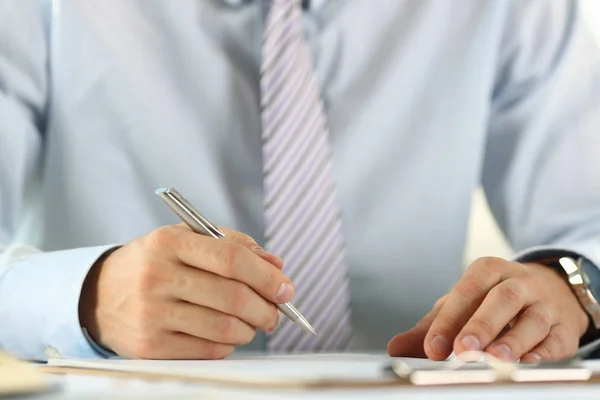 Male arm in suit and tie hold silver Stock Picture