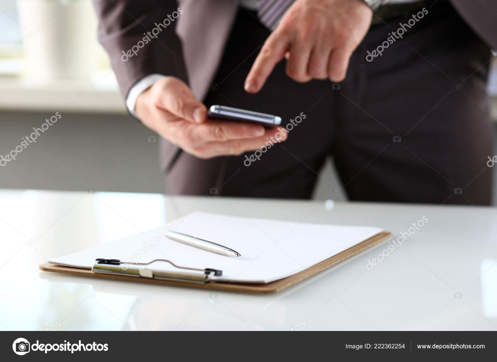 Silver Pen Lie At Paper Clipped To Pad On Table Stock Photo