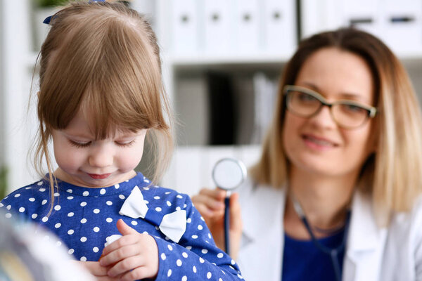 Little child with stethoscope at doctor reception