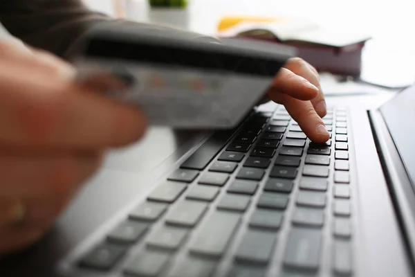 Male arms hold credit card press buttons making transfer — Stock Photo, Image