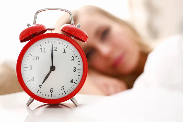 Young beautiful woman waking up in the morning alarm — Stock Photo, Image