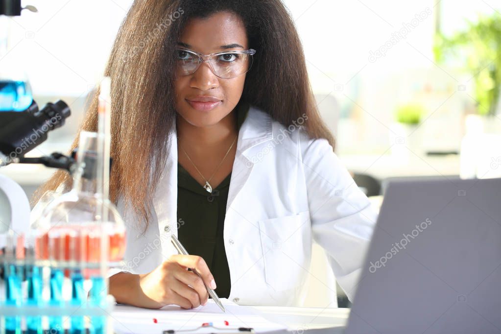 Black female chemist student conducting research
