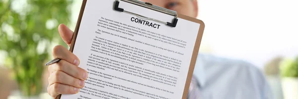 Male arm in suit offer contract form on — Stock Photo, Image