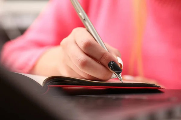 Woman study hard write down information to notebook — Stock Photo, Image