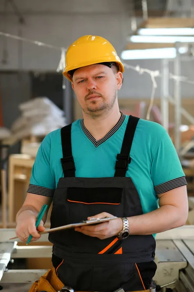 Portrait of young attractive man in work
