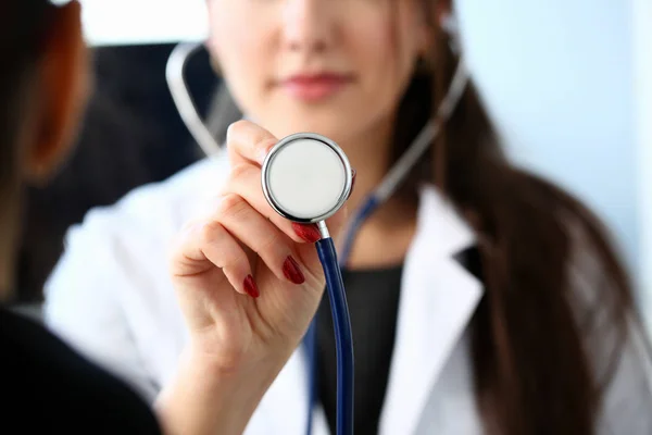 Beautiful smiling female doctor hold in arm — Stock Photo, Image