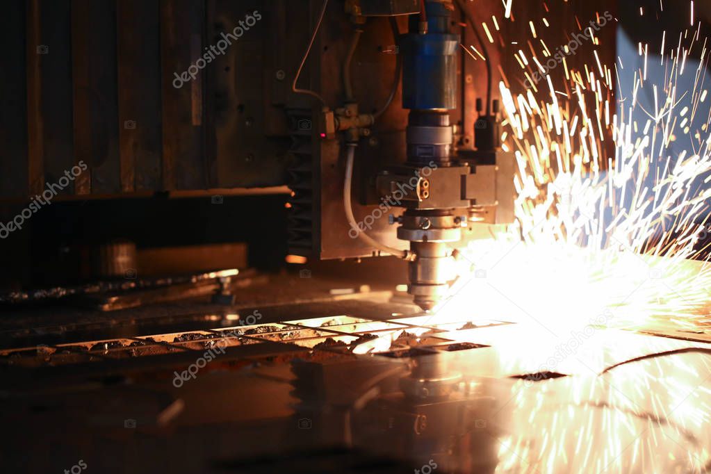 Sparks fly out machine head for metal processing