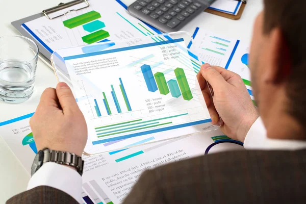 Businessman holding tablet in hands with