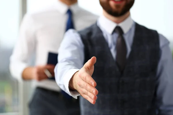 Man in suit and tie give hand as hello in office — Stock Photo, Image