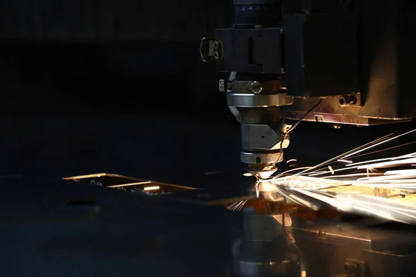 Sparks fly out machine head for metal processing