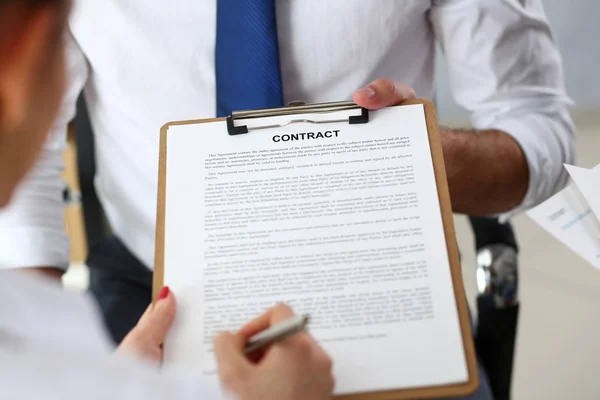 Male arm offer contract form on clipboard pad — Stock Photo, Image