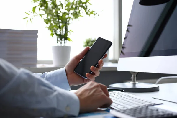 Businessman hipster holds telephone background of