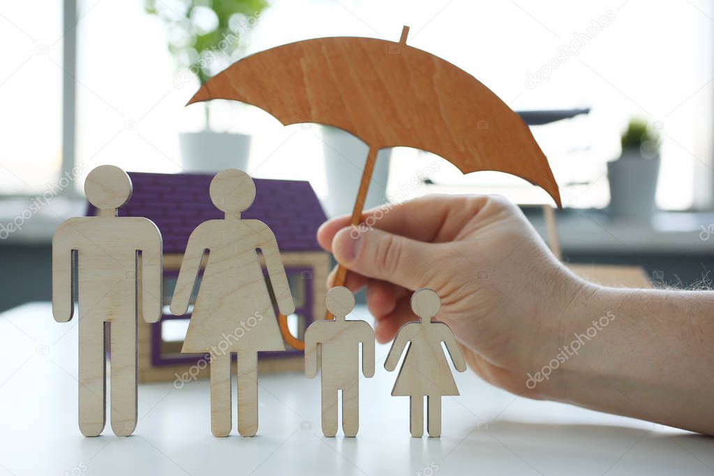 Male insurance agent hold hands gesture shield