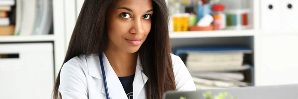 Beautiful black smiling female doctor