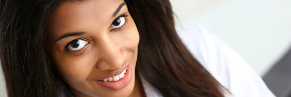 Beautiful black smiling female doctor at