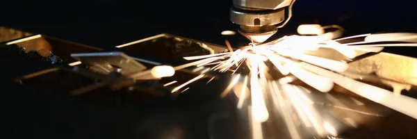 Sparks fly out machine head for metal processing