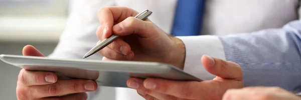 Group of businessmen point finger and silver pen in arms — Stock Photo, Image