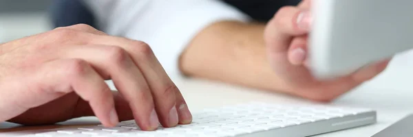 Male arms in suit typing on silver keyboard using computer pc — Stock Photo, Image