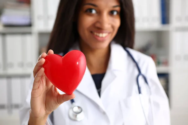 Beautiful black smiling female doctor hold