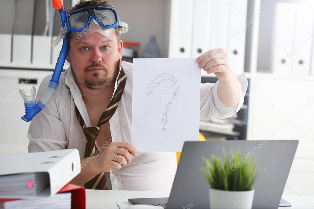 Man wearing suit and tie in goggles and snorkel